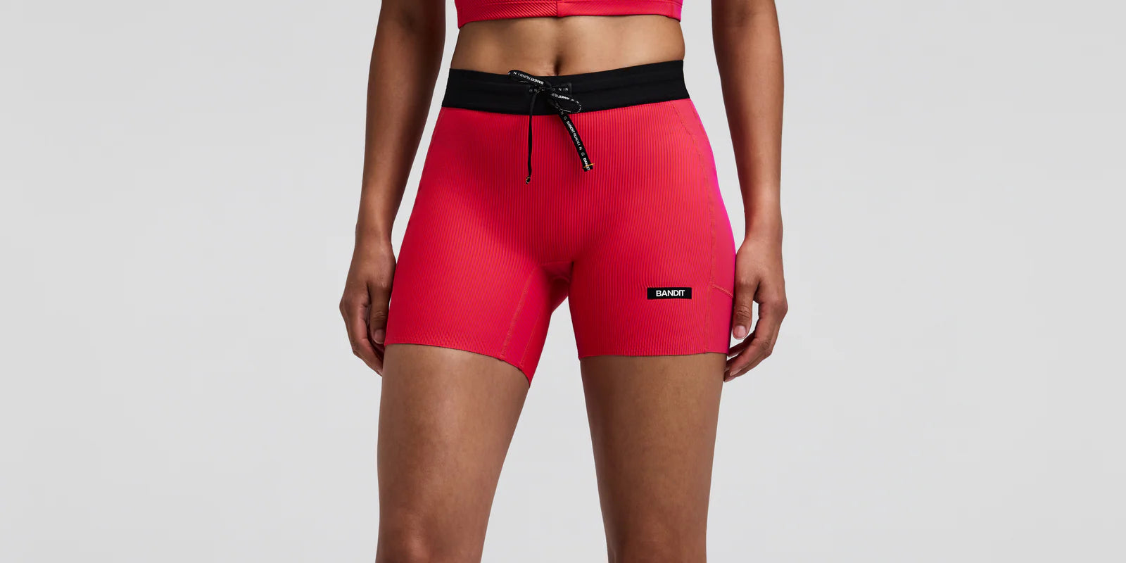 Bandit | Women's Striped Cadence™ 5" Compression Shorts - Poppy / Azalea